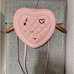 Heart shaped pink quilted charm bagpack
